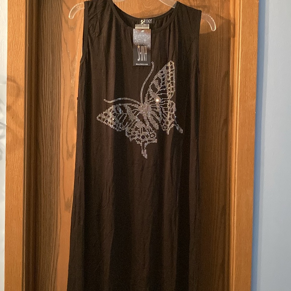 Shiny Peacock feather rhinestone tunic style blouse. Fit and tunic style blouse.